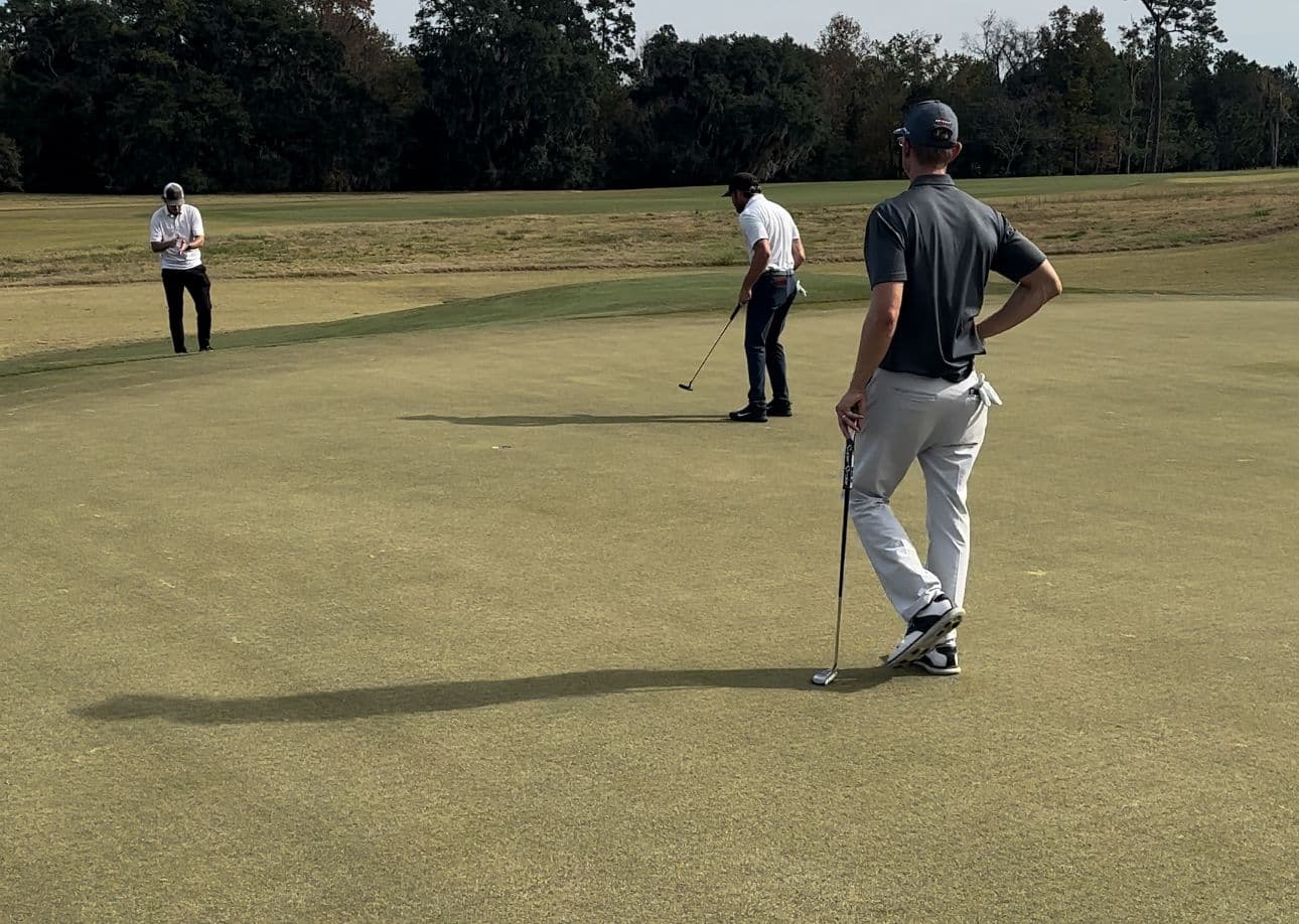 Taylor Funk fist pumps after making a birdie putt on 18 to advance to final stage.